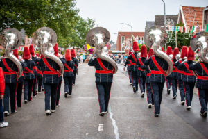 Details from a show and Marching band or fanfare and drum band with uniforms and Instruments.