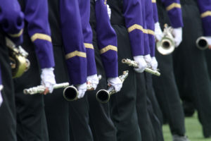 Marching band musicians performing.